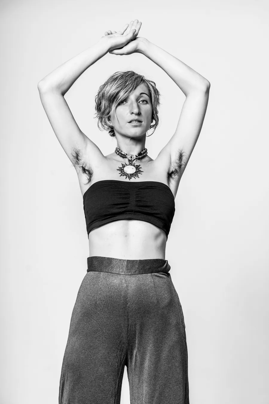 ZOE from Earth, black and white, arms raised overhead